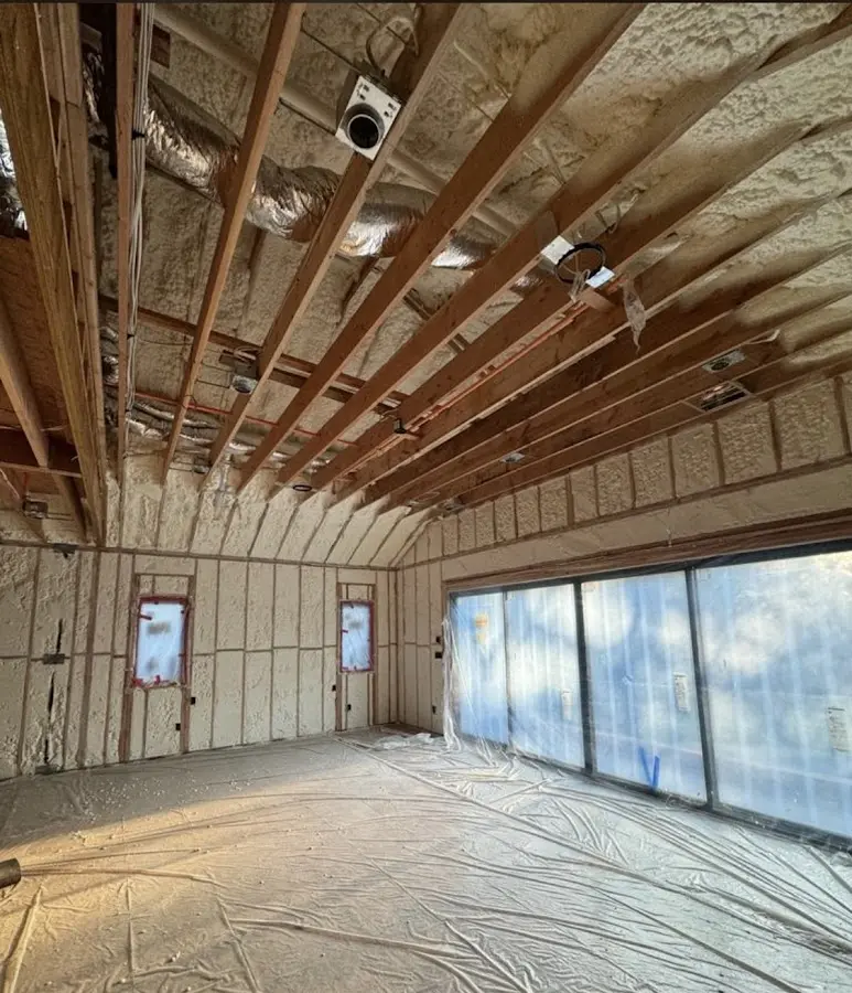 Interior walls and ceiling insulated with spray foam during new construction in Lapeer